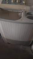 A picture of LG washing machine and Honda 3kva generator