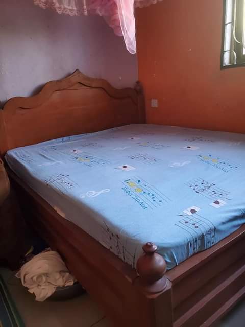 A picture of Kitanda 5 kwa 6 mbao yenyewe na godoro lake dodoma