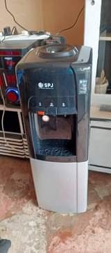 A picture of SPJ water dispenser with Hot water Warm water and Cold