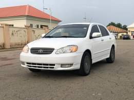 A picture of WHITE Nigeria Used Toyota Corolla LE 2004 Model With Custom