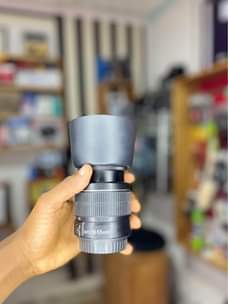 A picture of Canon 18 55mm lens with hood