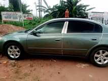 A picture of Nissan Altima engine ac cool gear perfect location 0werri 07040637386