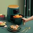 A picture of Air fryer pressure cooker and the speaker