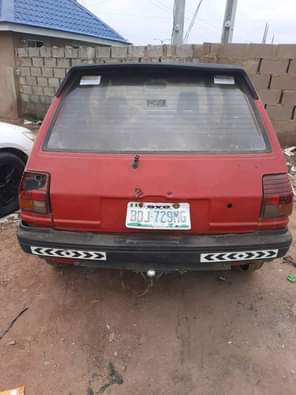 A picture of Toyota starlet two doors with smoking engine location Ibadan price