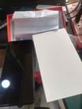 A picture of Itel s17 open box with carton and receipt