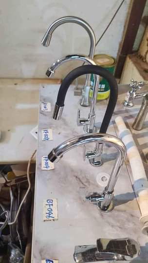 A picture of Tiles toilet seats sinks taps work tops etc
