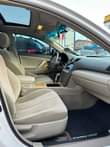 A picture of FOREIGN USED TOYOTA CAMRY 2011 Model Interior Clean 2023 headlight