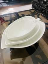 A picture of Glass vessels chairs and pasi table