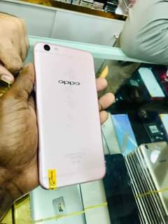 A picture of Oppo r9s plus with some scratches on the screen available