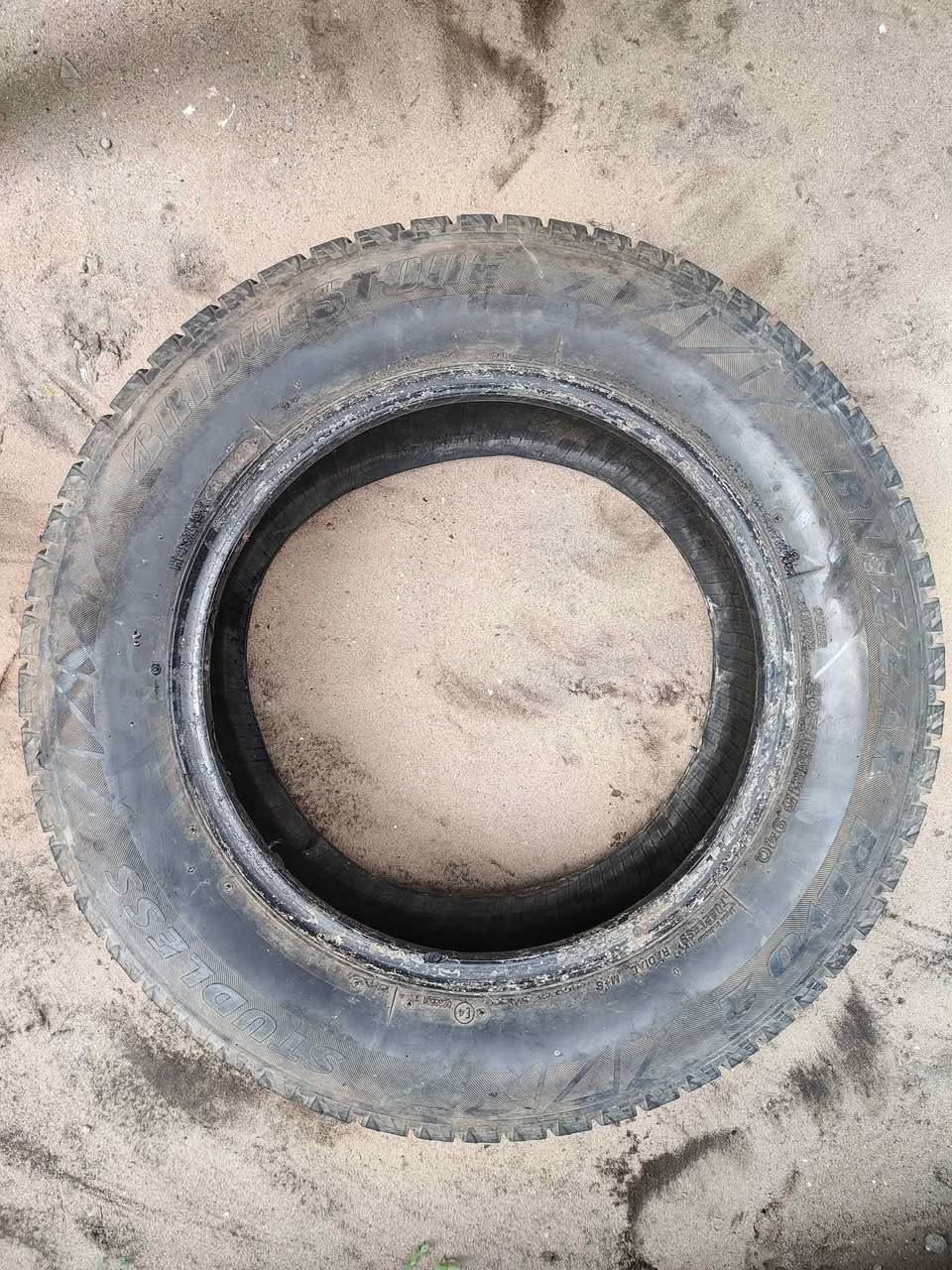 A picture of Bridgestone 205 65 15 tire Thread intact