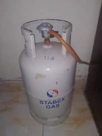 A picture of Sofa clothes rack and cylinder