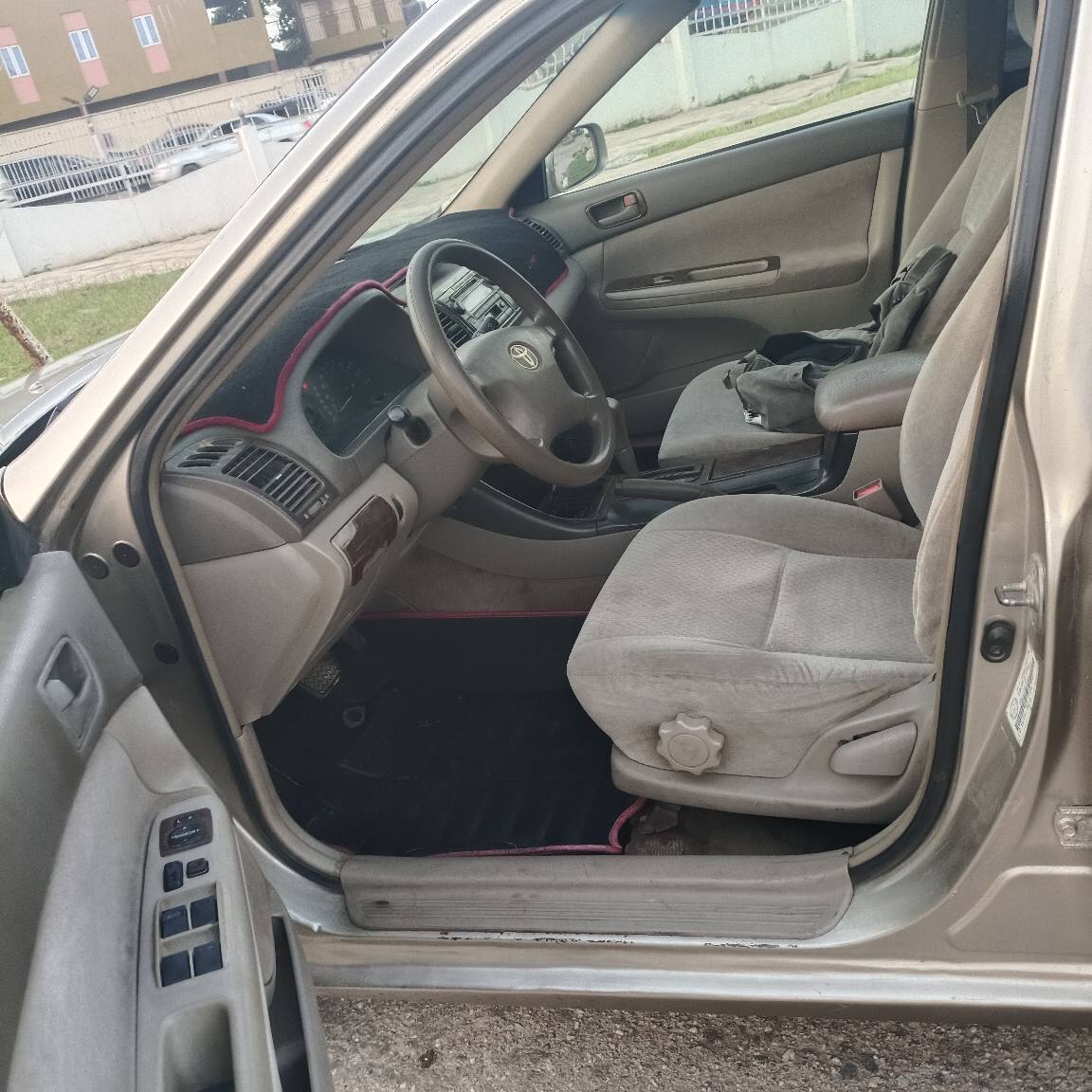 A picture of Toyota Camry 9ja used baked on first body everything is
