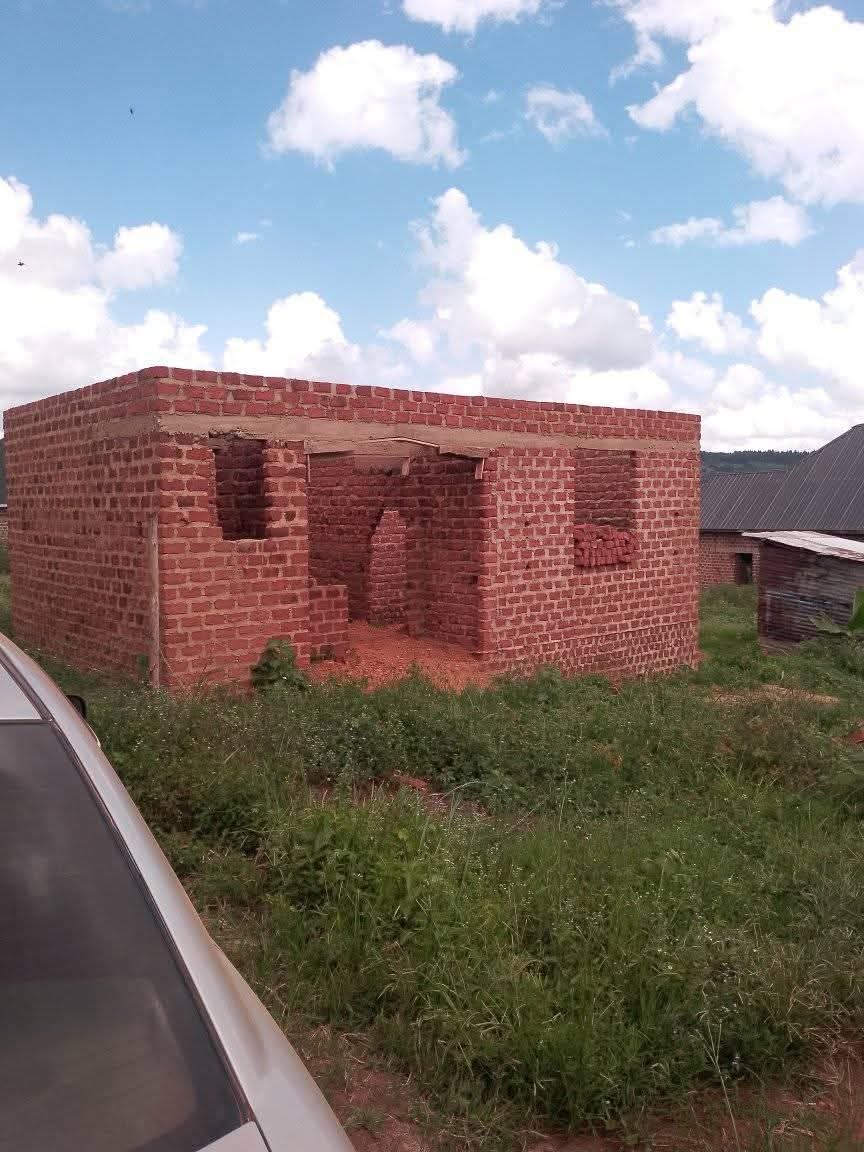 A picture of Plot and house
