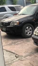 A picture of Mazda Tribute Everything perfect AC needs gas Going for 900k