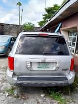 A picture of HONDA PILOT CAR HAS BEEN PARKED FOR LONG