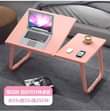 A picture of Foldable and portable laptop desk or WhatsApp 0784884323