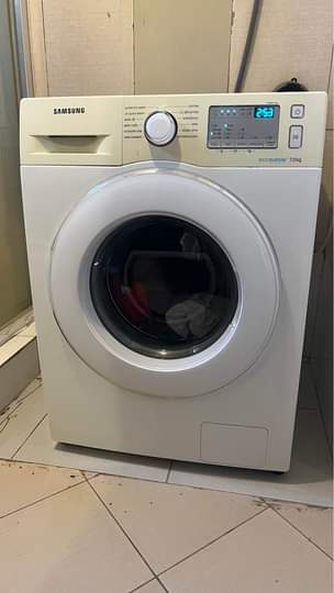 A picture of Washing machine storage printer and kids feeding chair water dispenser