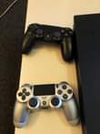 A picture of USED PS4 PRO 1TB WITH 4 PADS AT A GIVEAWAY