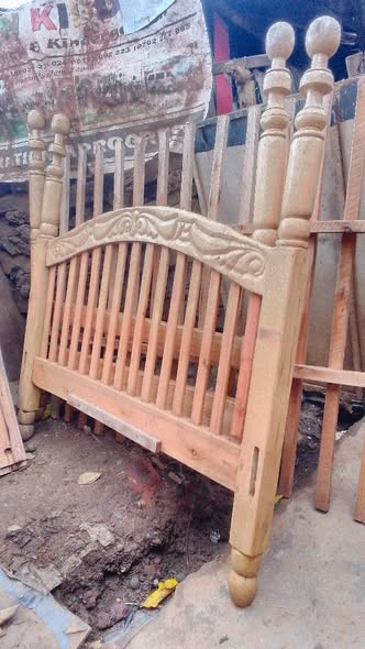 A picture of It s a used 5by6 wooden bed in good condition