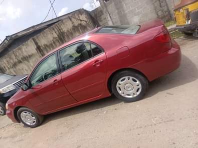 A picture of Toyota Corolla 2006 Color Red Properly Used Baked on First