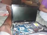 A picture of Part s off a loptop acer in need of window