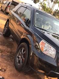 A picture of Clean Nigerian Used Black Honda Pilot Repainted on first body