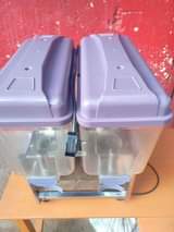 A picture of U k used juice dispenser that does both cooling and
