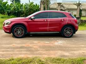 A picture of 2016 registered Mercedes Benz GLA250 pepper red on black