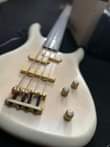 A picture of 1 Fernandes bass combo 2 GrassRoots original bass guitar 3
