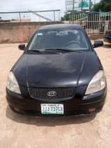 A picture of URGENT SALE Clean Reg KIA Rio auto drive fabrics Ac