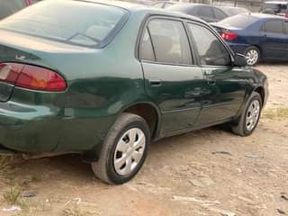 A picture of Extremely clean Toyota Corolla small but mighty With Sound Engine