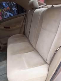 A picture of Toyota Corolla 2004 Gold very neat