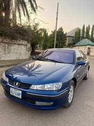 A picture of Very clean 406 manual with complete original papers and duty