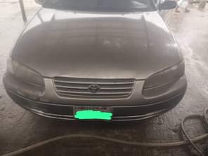 A picture of TINY CAMRY LIGHT ENGINE GEAR AC NEEDS GAS BODY OKAY