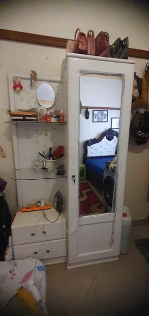A picture of Bed matress and dressing mirror