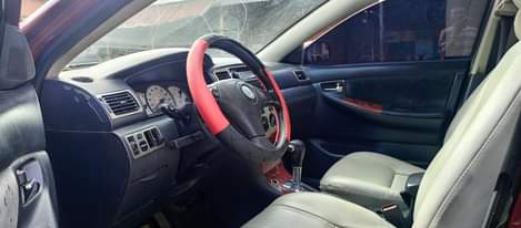 A picture of Clean in and out Toyota Corolla with very sharp Engine