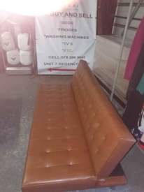 A picture of BROWN LEATHER SLEEPER COUCH IN A GOOD CONDITION