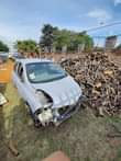 A picture of Nissan micra 2006 striped with paper