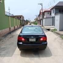 A picture of Must Go Today Sharp Black 2004 Toyota Corolla first body