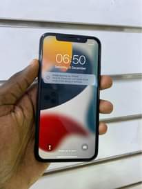 A picture of iPhone X 256gb faceid working 730k WhatsApp or call 0759979422