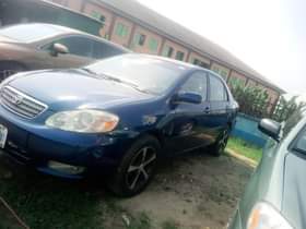 A picture of Make Toyota Model Corolla Year 2004 Color Blue Engine Perfect