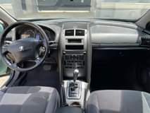 A picture of TORQUESE NIGERIAN USED PEUGEOT 407 2005 MODEL WITH ORIGINAL PAPERS