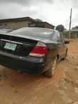 A picture of Toyota Camry 2004model engine and gear is okay AC needs