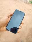 A picture of iPhone 11 64gb working perfectly Face ID active True Tone