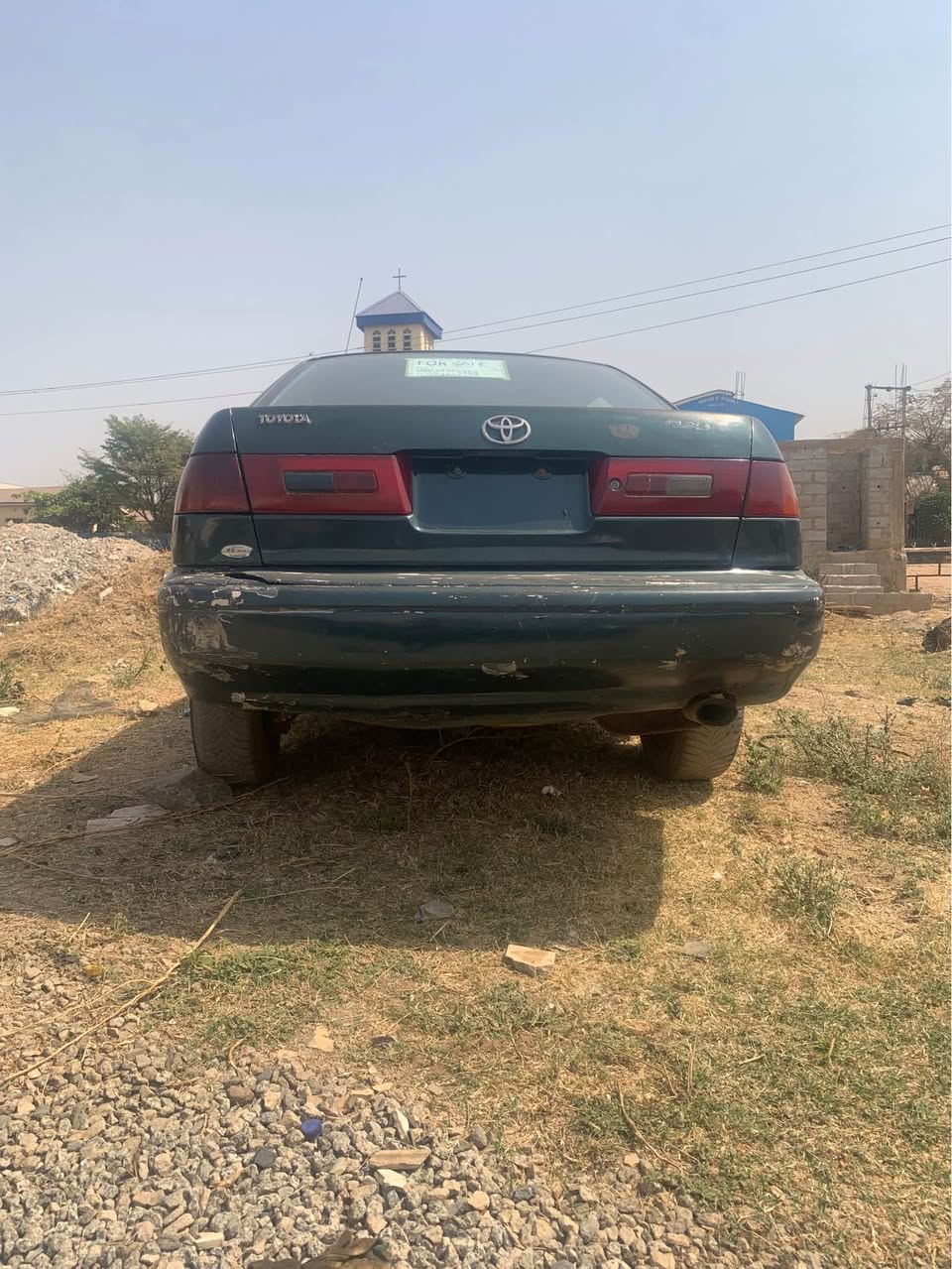 A picture of Old model Toyota Corolla engine needs fixing but with very