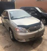 A picture of Clean Nigerian Used Silver Toyota Corolla 2003 Repainted Fabric interior