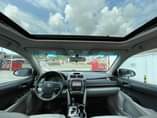 A picture of Toks XLE Toyota Camry 2014 model leather seats and Formica
