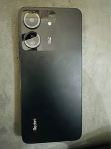 A picture of Redmi phone in good condition used for a week