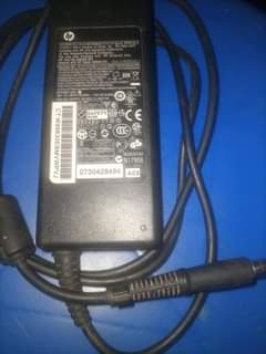 A picture of HP original laptop charger swap for a Dell charger