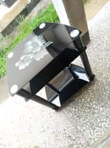 A picture of TV shelf and Gotv decoder